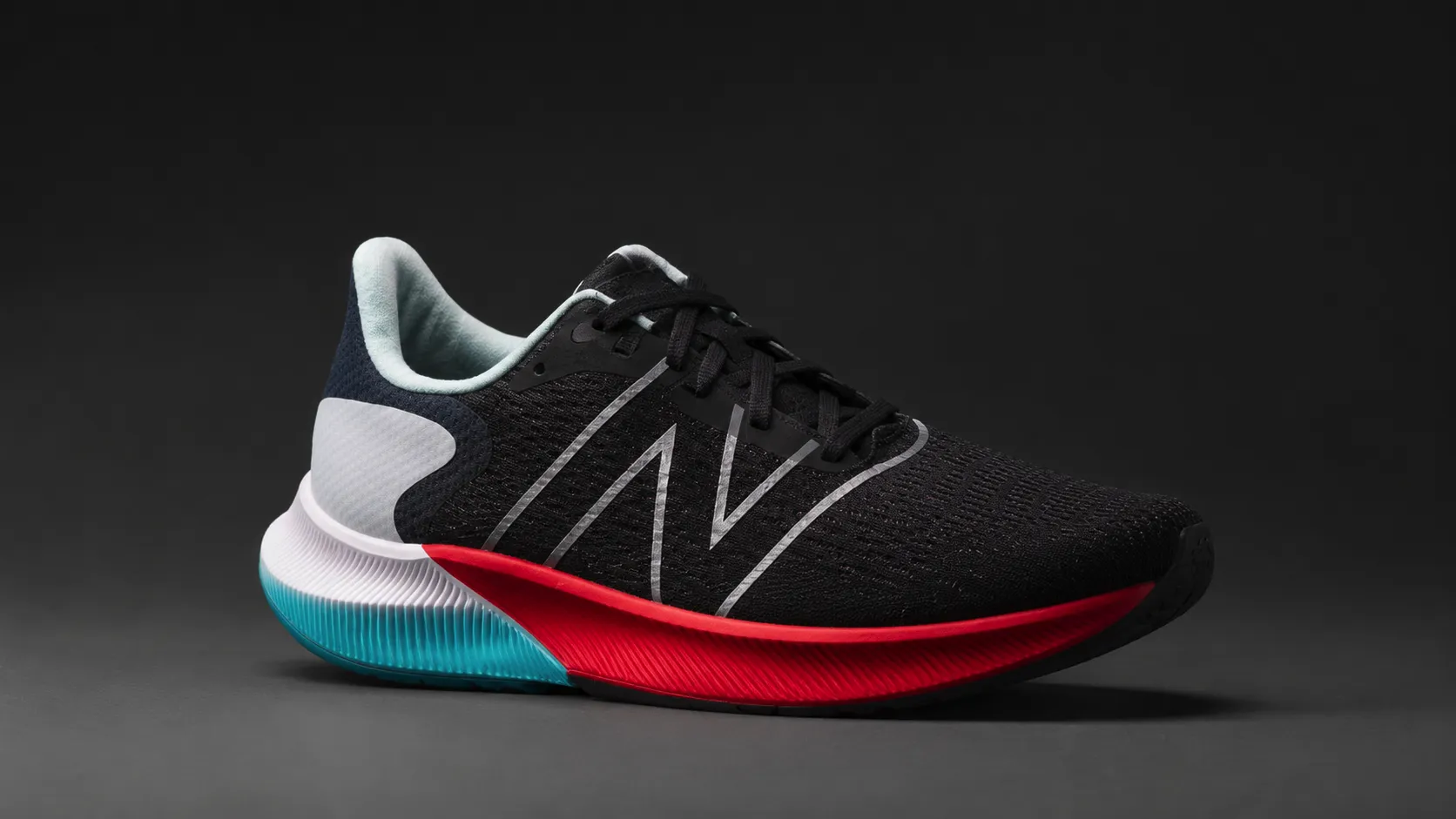 Black performance shoe on a neutral background before AI editing